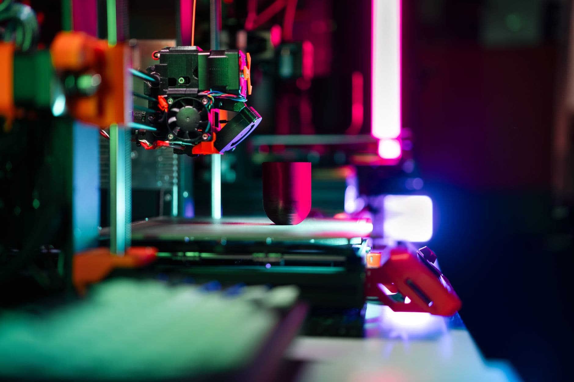 A 3D printer building a plastic part layer by layer