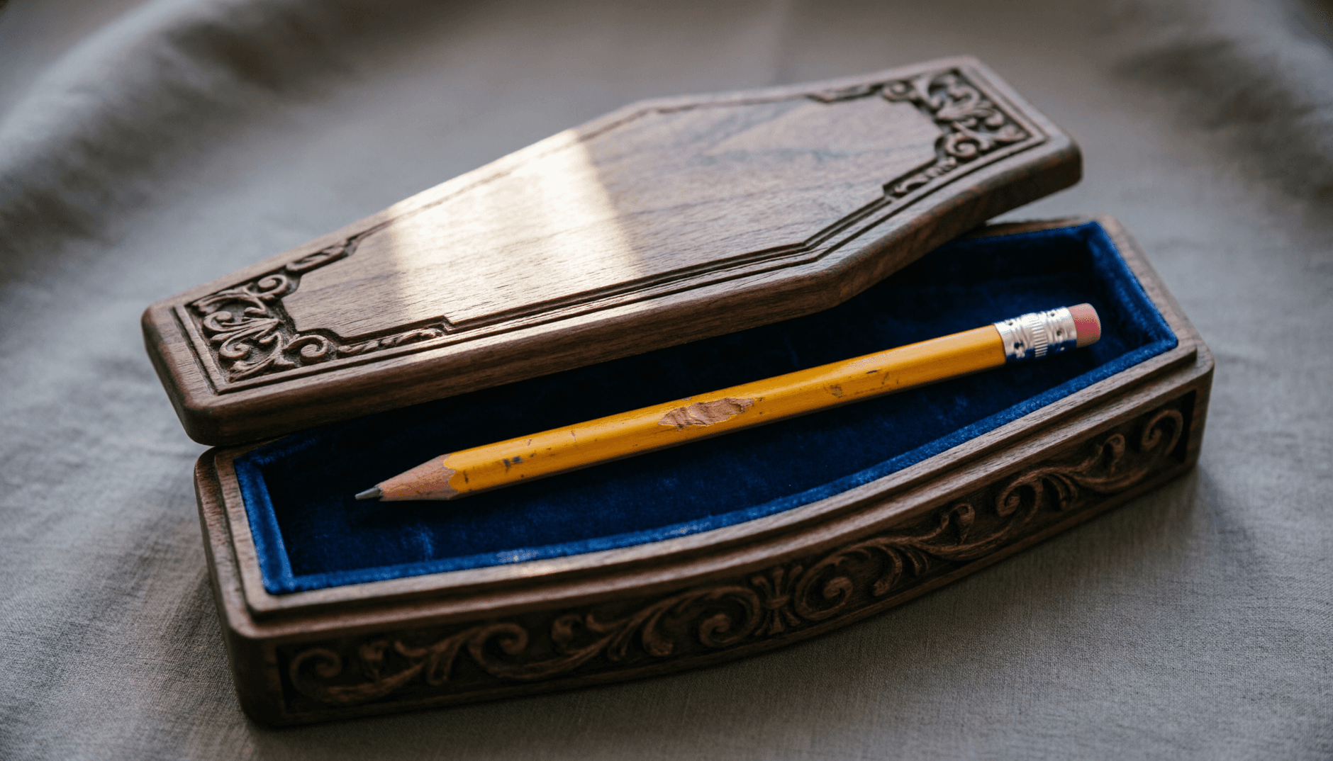 A handmade wooden keepsake box on a workbench